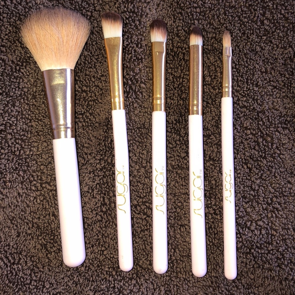 Pink colored makeup brushes